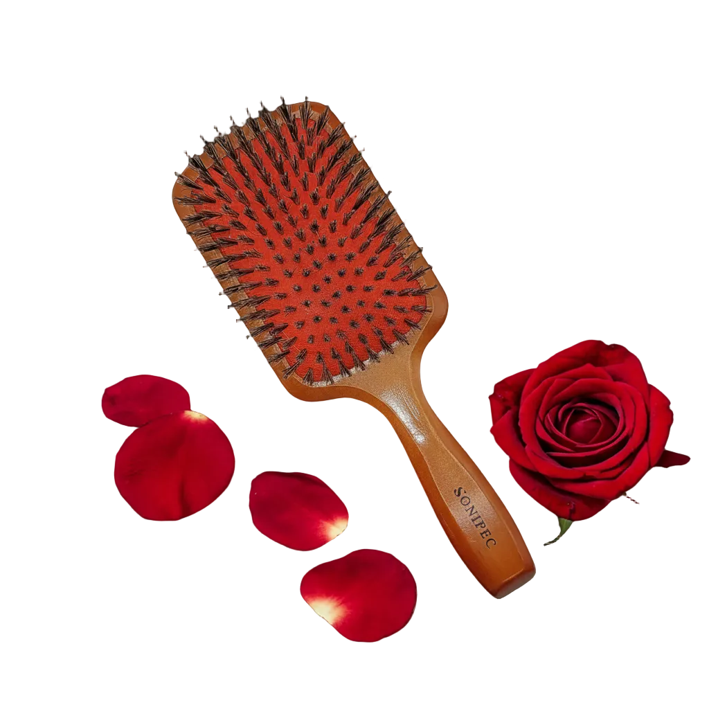 Rose hairbrush with repositioned rose