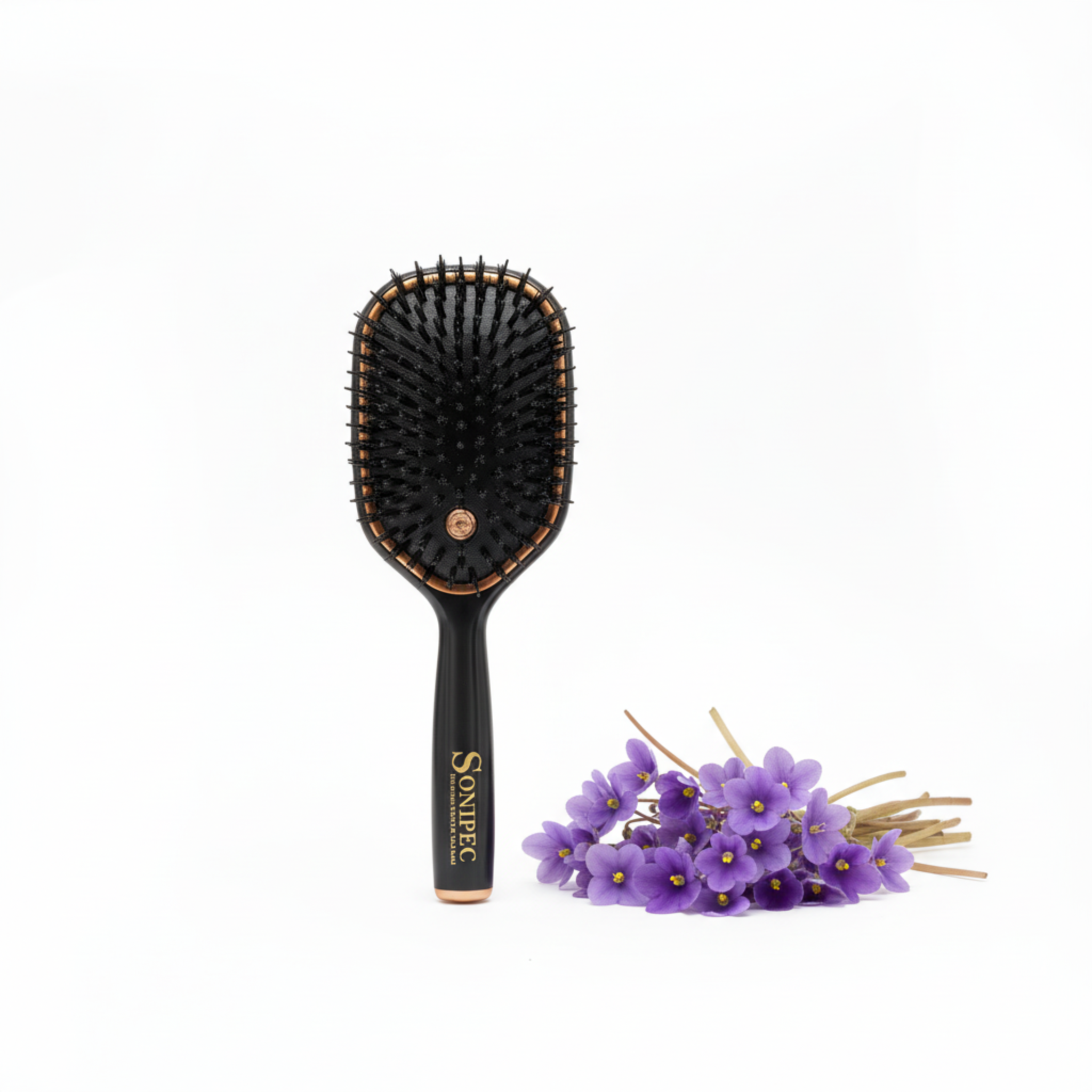 Violet hairbrush with violet flowers